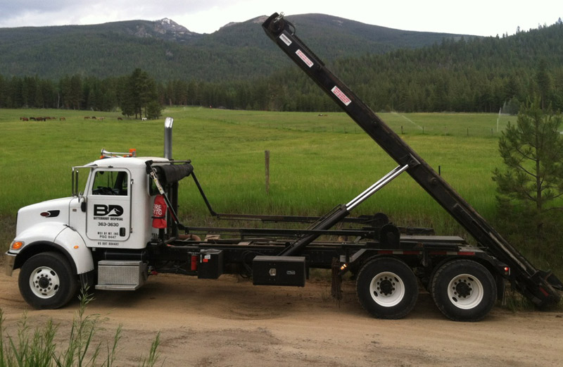 Roll-Off truck with lift up.